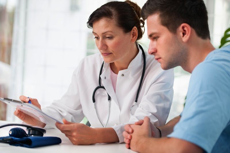 A young man meets with his doctor.