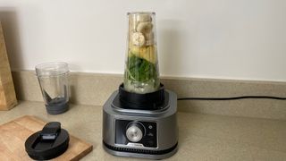 Ninja Foodi Power Blender & Processor System with banana and spinach ingredients inside