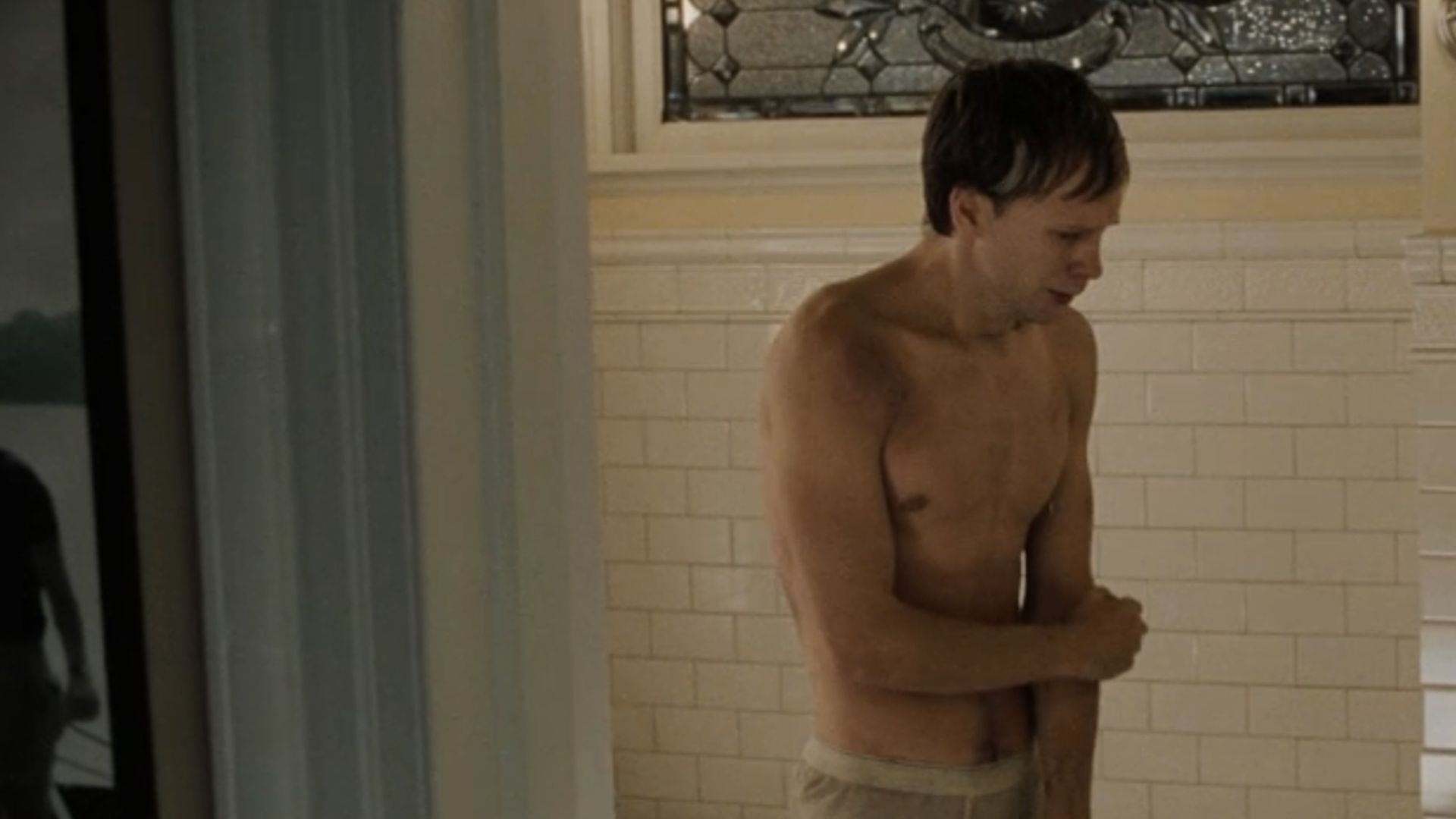 Donnie Wahlberg standing scared in a bathroom in The Sixth Sense