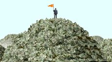 man standing on a pile of money