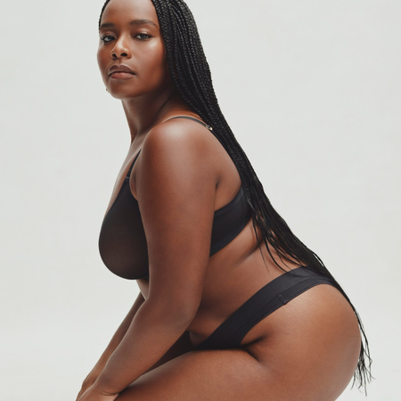 Photo of Cuup model wearing the black best plus size lingerie.