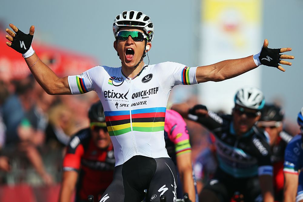 Michal Kwiatkowski (Etixx-QuickStep) lifts his arms in a victory salute