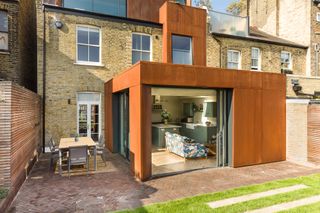 corten clad modern extension to terrace house