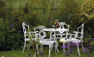 pretty wrought iron outdoor dining set in a garden in hampshire