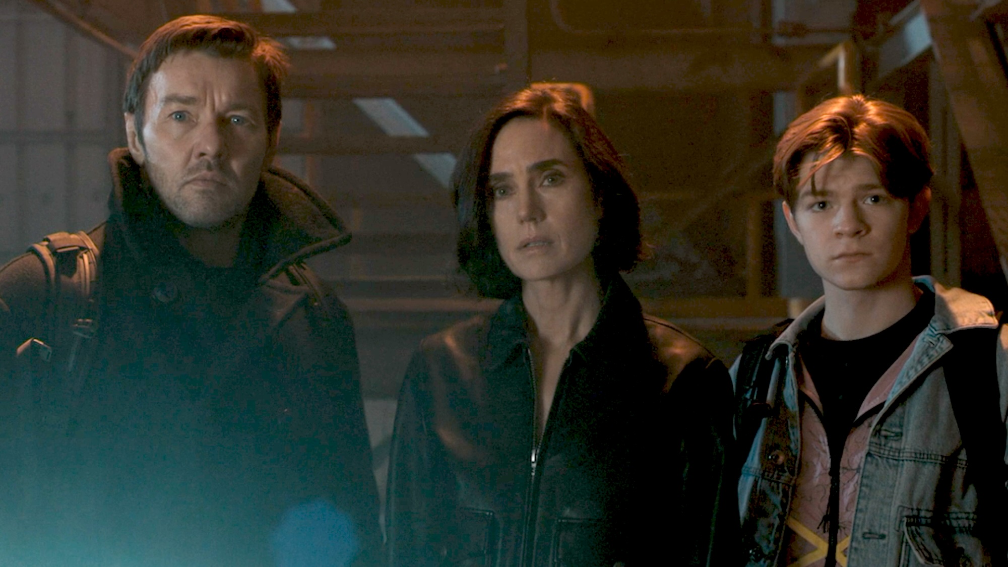 Joel Edgerton, Jennifer Connelly, and Oakes Fegley standing together in Dark Matter