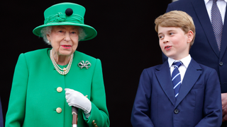 Queen Elizabeth II and Prince George of Cambridge stand on the balcony of Buckingham Palace following the Platinum Pageant on June 5, 2022 in London, England