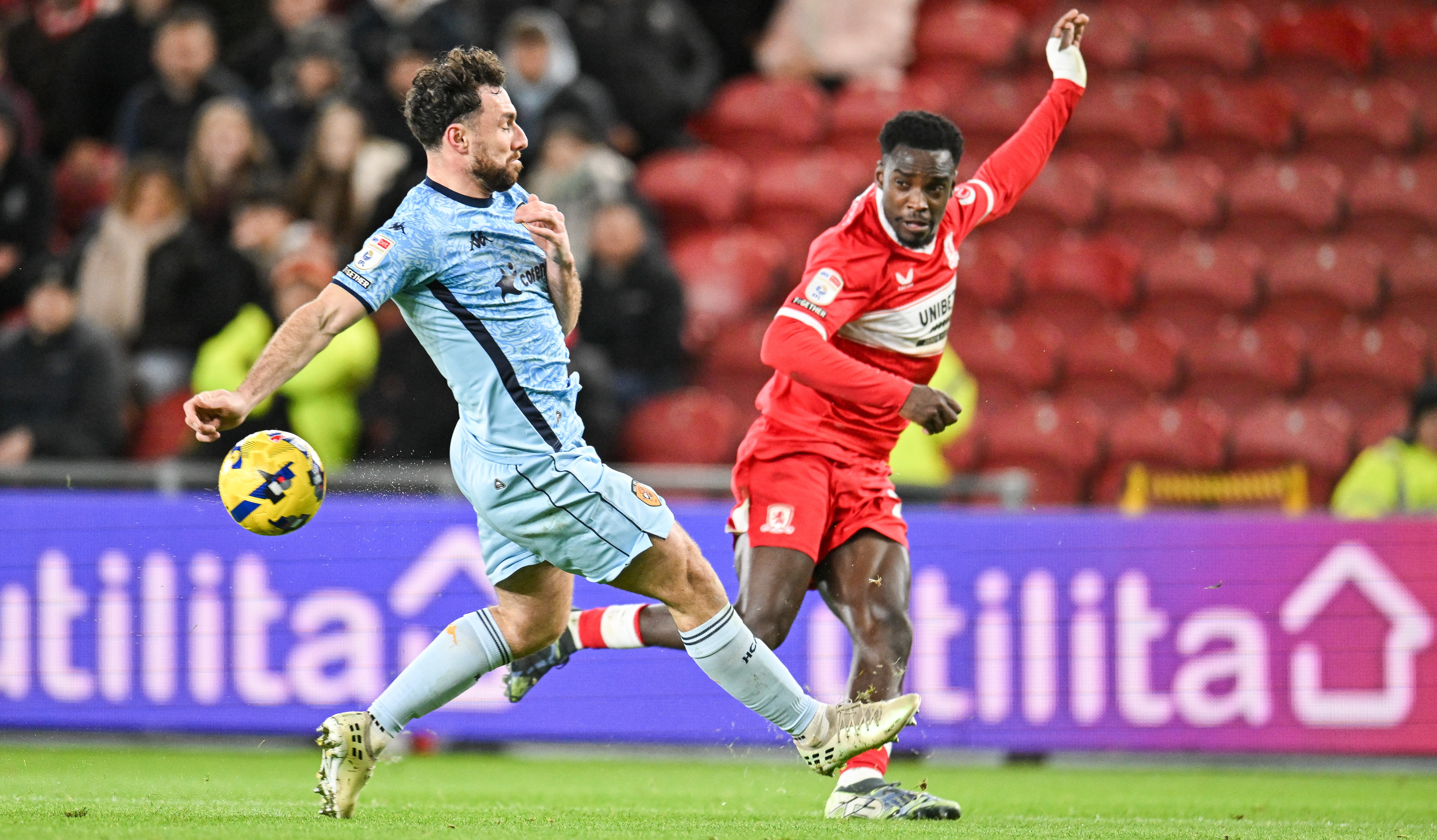 Alex Bangura of Middlesbrough FC crosses the ball before Lewis Coyle of Hull City fails to reach him during the Sky Bet Championship match between Middlesbrough and Hull City at the Riverside Stadium