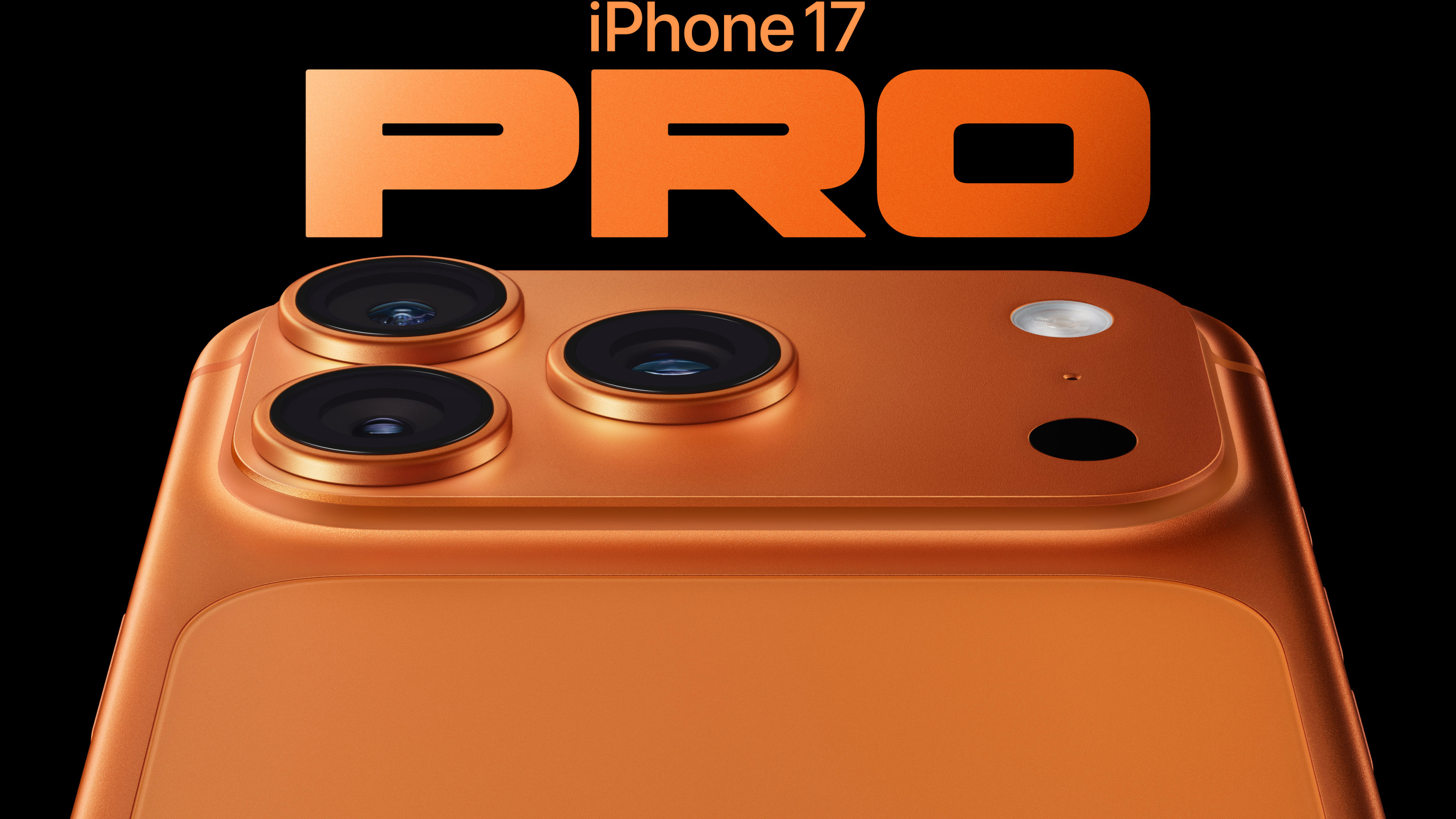 Apple iPhone 17 Pro press image on black, close up of the rear camera bump on its back and orange text above the iPhone reads 'iPhone 17 PRO'