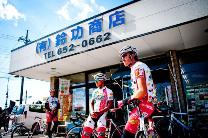 In front of a Japanese grocer's, The guys from Jelly Belly Cycling Team take a rest in traning before Japan Cup 2012
