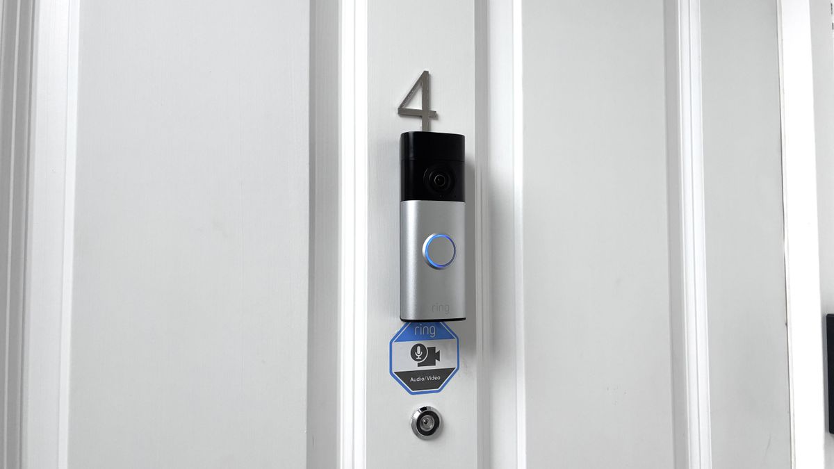Ring Battery Video Doorbell Plus (2nd Gen) mounted on front door above peephole