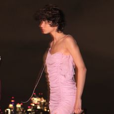 a model wearing a ruched supriya lele for mango dress