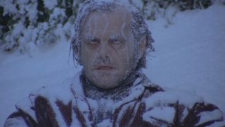 Jack Nicholson sits frozen at the end of The Shining