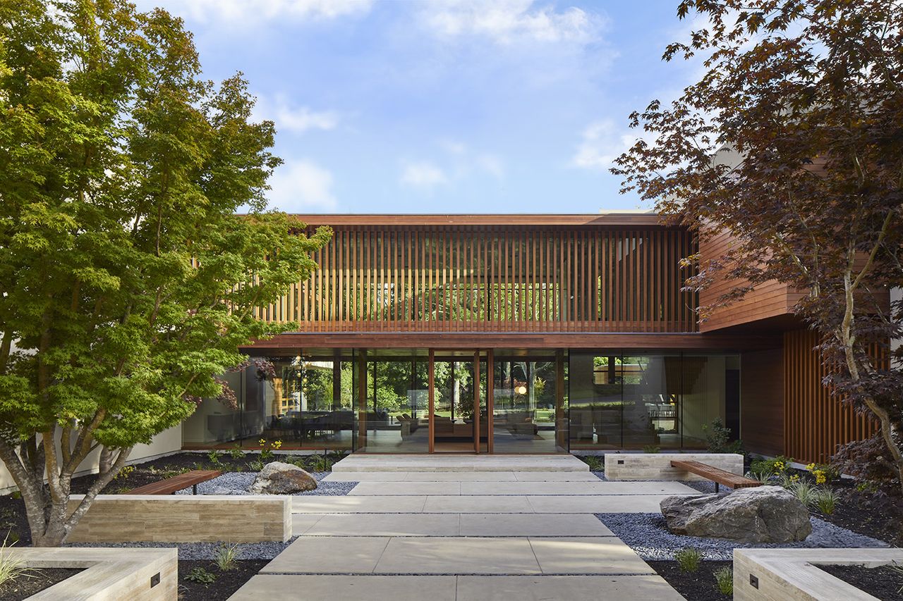 Happy Valley House exterior of cantilever behind trees