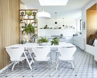 A kitchen with a vinyl floor in a pattern emulating 3D-style diamond tile pattern.