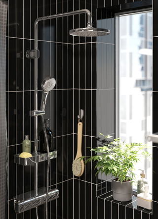 Black bathroom with houseplant by Ikea