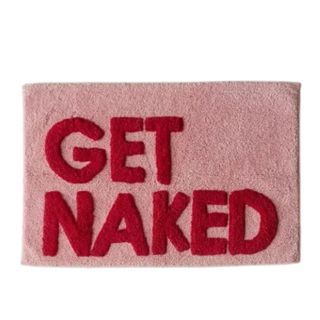 A pink and red bath mat that says 'get naked'