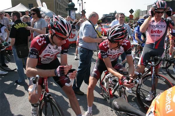 CSC team-mates Jens Voigt and Frank Schleck talk before the start.