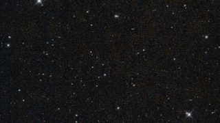 view of a patch of deep space, with many distant stars visible