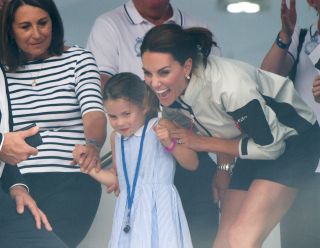 Carole Middleton with Princess Charlotte and Kate Middleton COWES, ENGLAND - AUGUST 08: Carole Middleton, Princess Charlotte and Catherine, Duchess of Cambridge attend the presentation following the King's Cup Regatta on August 08, 2019 in Cowes, England. (Photo by Samir Hussein/WireImage)
