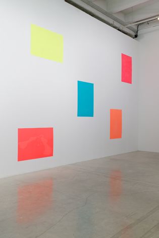 white wall with colourful patches