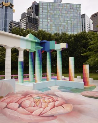 Coourful pillars and painting of a flower in a park
