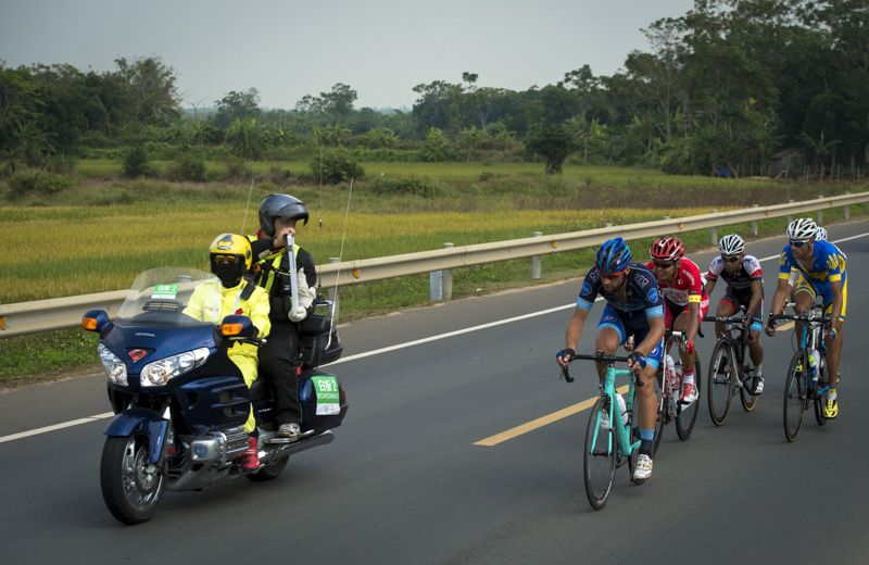 The breakaway riders plough on