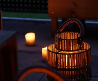 Candles and a lantern on a balcony