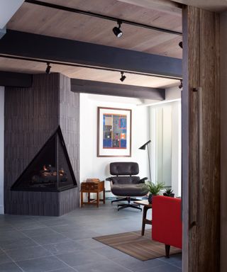 Modern black corner fireplace with gallery wall on white blank canvas