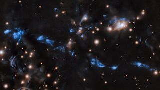 The knotted young stellar jet, MHO 1502, is embedded in an area of star formation known as an HII region.