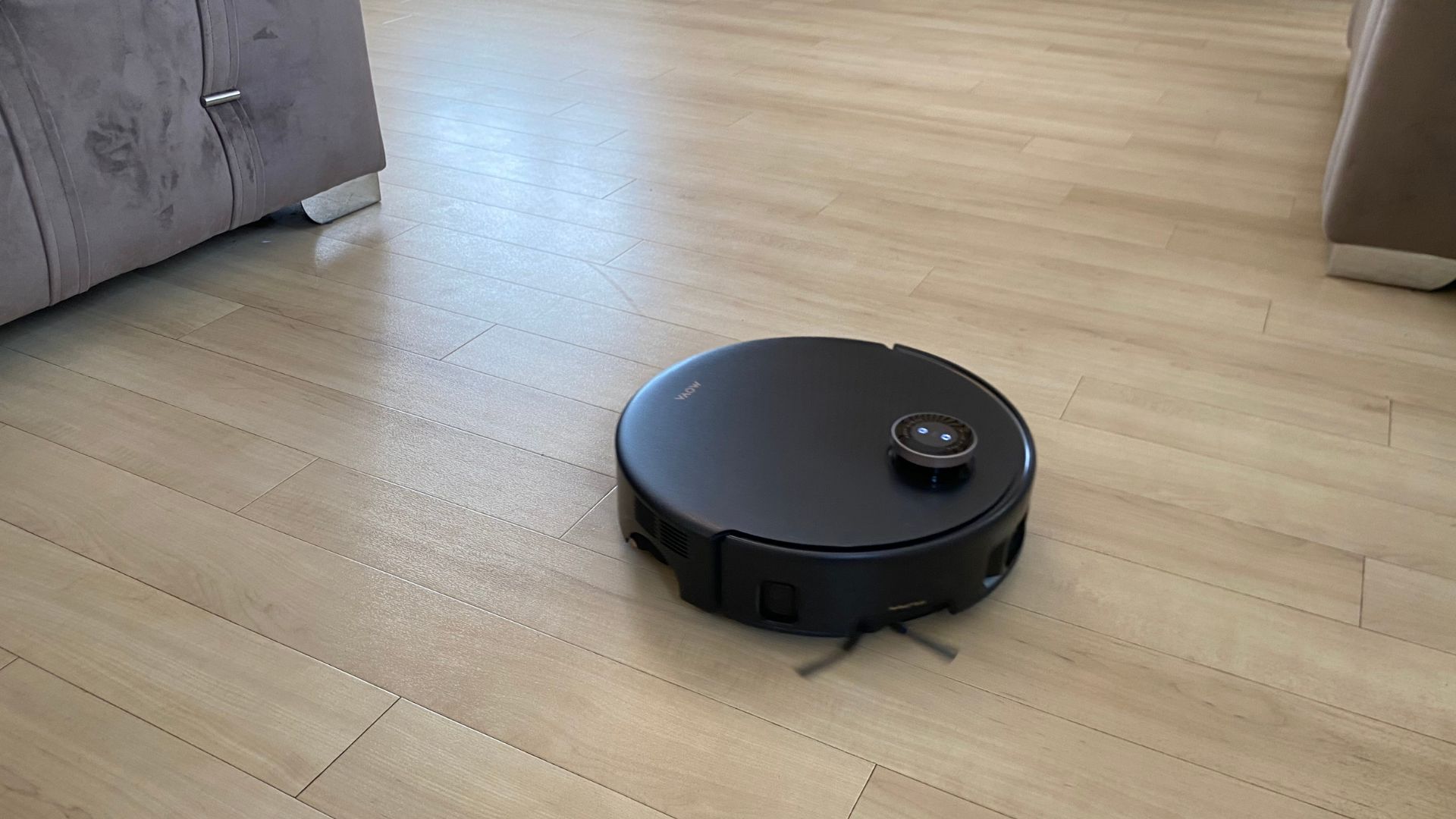 MOVA Z60 Ultra Roller Complete Robot Vacuum working on wooden floors in Carly's home