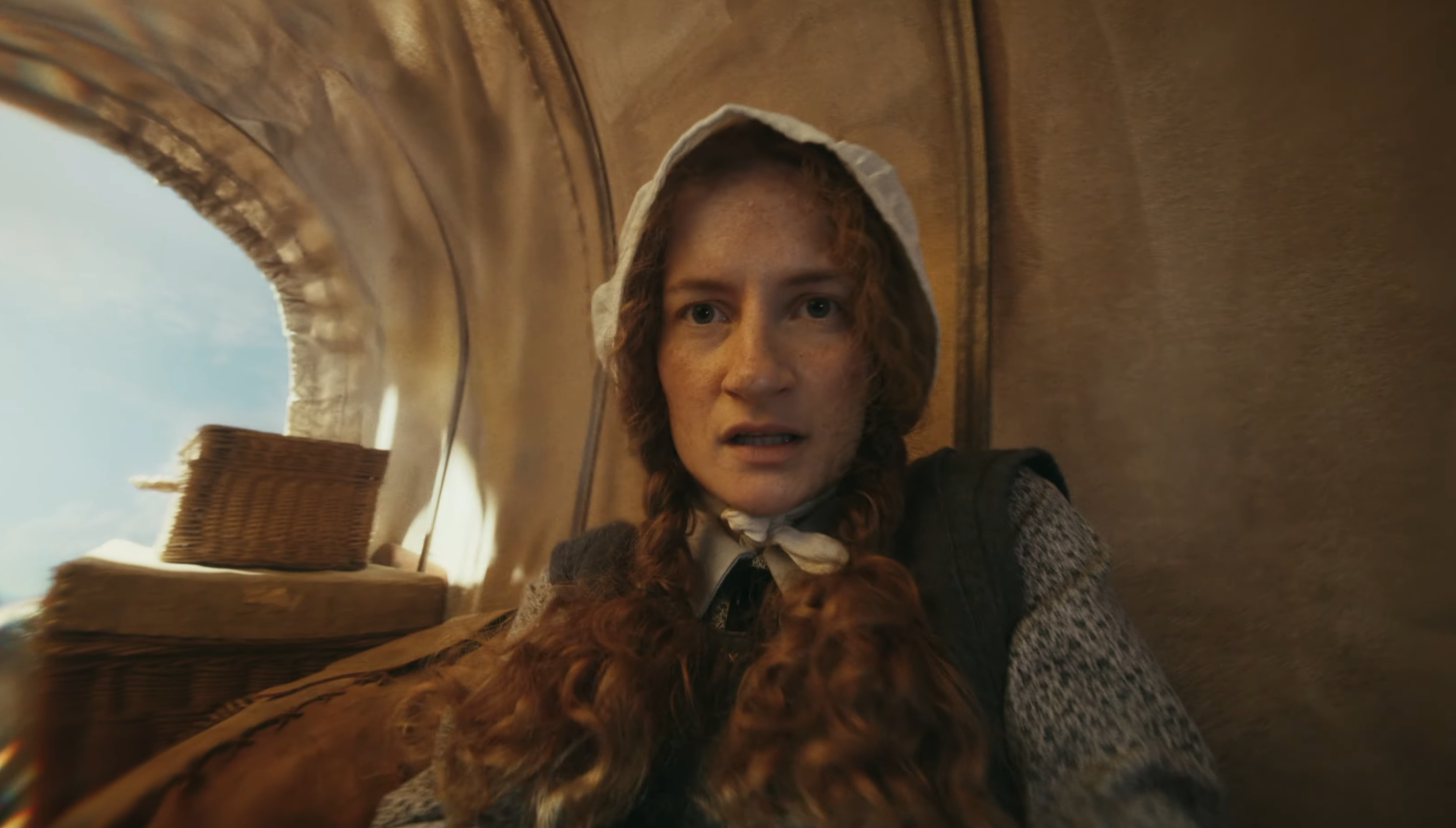 Humankind 2 trailer still showing a settler in a wagon.