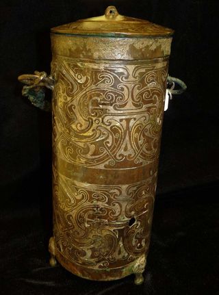This Chinese bronze container from the Late Zhou Dynasty is inlaid with gold and silver.