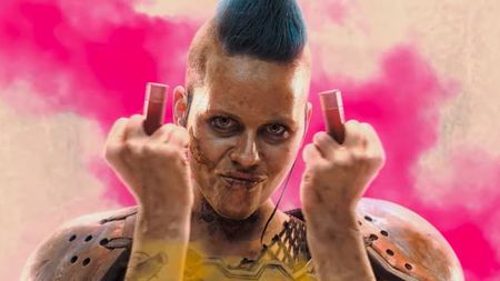 A woman from the Rage 2 trailer makes an obscene gesture with shotgun shells.