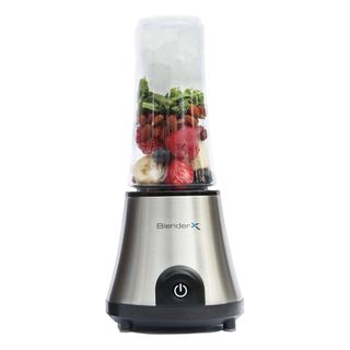 A BlenderX Cordless Blender filled with berries, nuts, greens, and ice