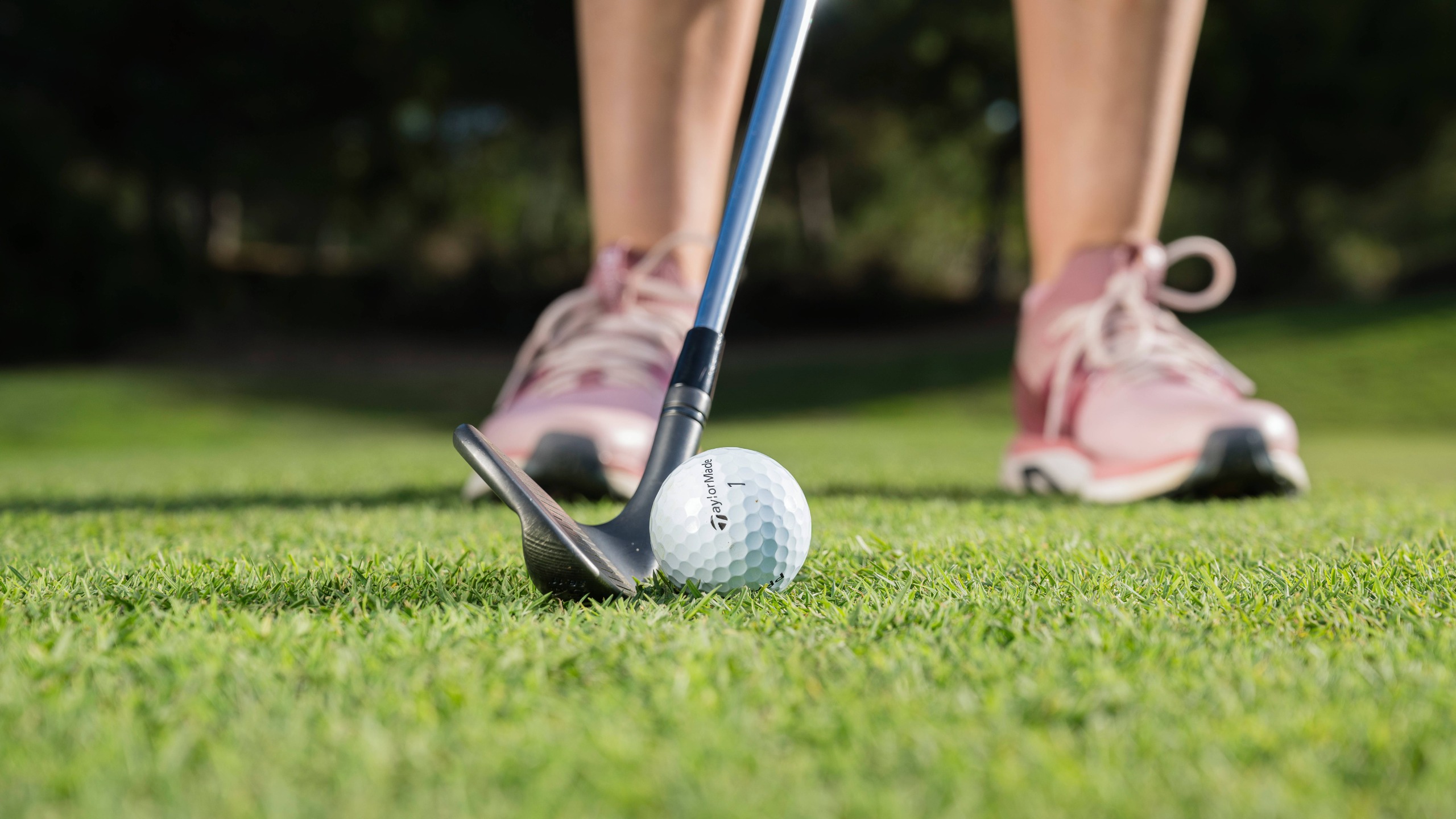 Ball positioned back for a chip shot