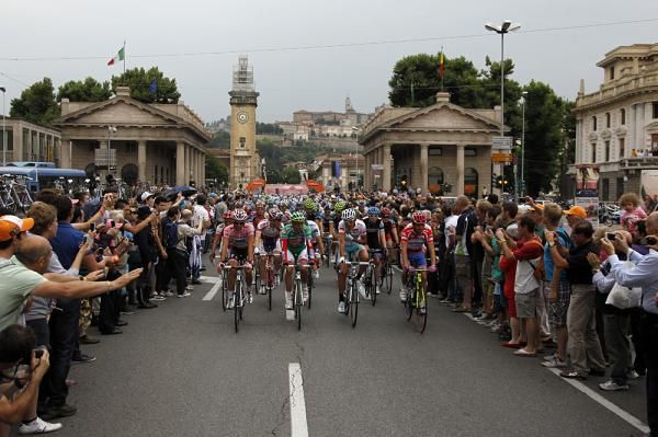 The peloton heads out from Bergamo
