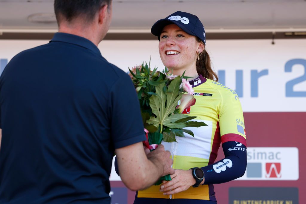 EDE NETHERLANDS SEPTEMBER 05 Charlotte Kool of The Netherlands and Team DsmFirmenich celebrates at podium as Yellow Leader Jersey winner during the 25th Simac Ladies Tour 2023 Prologue a 24km individual time trial stage from Ede to Ede UCIWWT on September 05 2023 in Ede Netherlands Photo by Bas CzerwinskiGetty Images