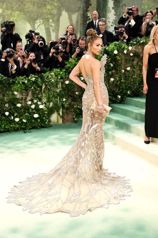 Jennifer Lopez in a sheer, crystal Schiaparelli gown at the 2024 Met Gala