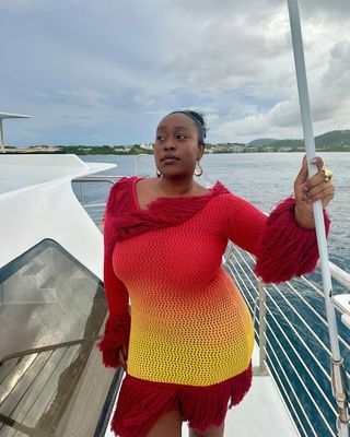 Woman wearing red crochet cover-up.