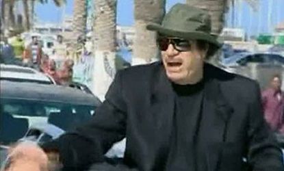 On April 14, Moammar Gadhafi apparently drove around Tripoli in an open-top vehicle while NATO bombed the Libyan capital.