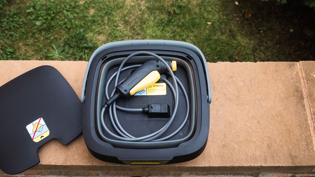 Details of the K&auml;rcher OC3 Foldable Mobile Pressure Washer showing the hose and pressure gun stored