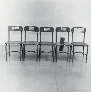 Black and white picture of 5 chairs