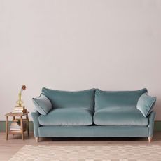 A blue velvet Loaf sofa bed