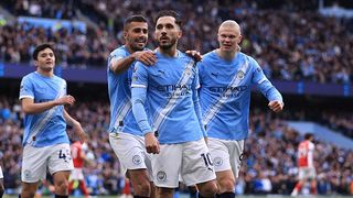 Rayan Cherki of Manchester City celebrates scoring their 1st goal during the Premier League match between Manchester City and Arsenal at Etihad Stadium. 