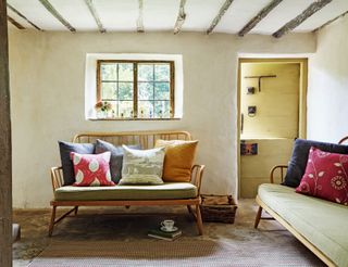 Country cottage with mid-century ercol sofas