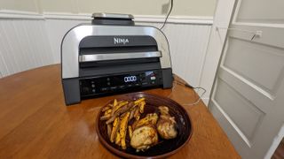 Ninja Foodie Smart XL 6-in-1 Indoor Grill & Air Fryer with Built-In Thermometer, 2nd Generation air frying chicken and fries