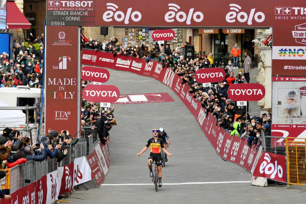 SIENA ITALY MARCH 05 A general view of Lotte Kopecky of Belgium and Team SD Worx celebrates winning ahead of Annemiek Van Vleuten of Netherlands and Movistar Team during the Eroica 8th Strade Bianche 2022 Womens Elite a 136km one day race from Siena to Siena Piazza del Campo 321m StradeBianche on March 05 2022 in Siena Italy Photo by Luc ClaessenGetty Images