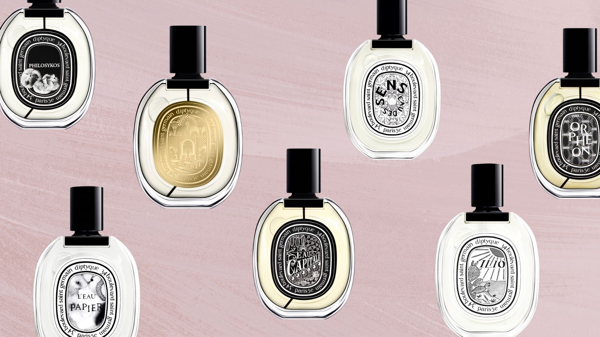 seven of our best Diptyque perfumes - Philosykos, L'eau Papier, Eau Nabati, L'Capitale, Eau De Sens, Ilio and Orpheon - on a brushed mauve background