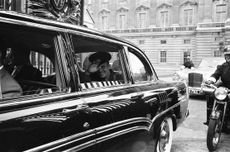 Yuri Gagarin, the Soviet Cosmonaut and the first human to journey into outer space when his Vostok spacecraft completed an orbit of the Earth (12th April 1961), visited Britain in July of that year. Here, Gagarin is pictured waving as he leaves Buckingham Palace after lunch with Queen and Prince Philip. Photo: Alamy