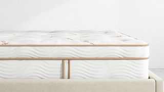 Saatva vs WinkBeds: image shows the Saatva Zenhaven Mattress from the side to show off the edge support system